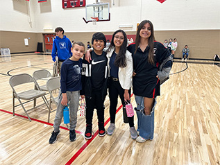 Three female staff members in the hall